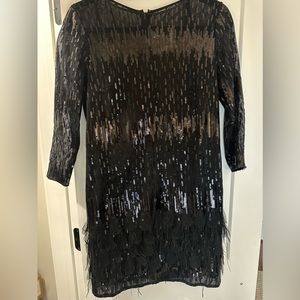 Tahari black cocktail dress. Size 4, fun feathers on the bottom, worn once.